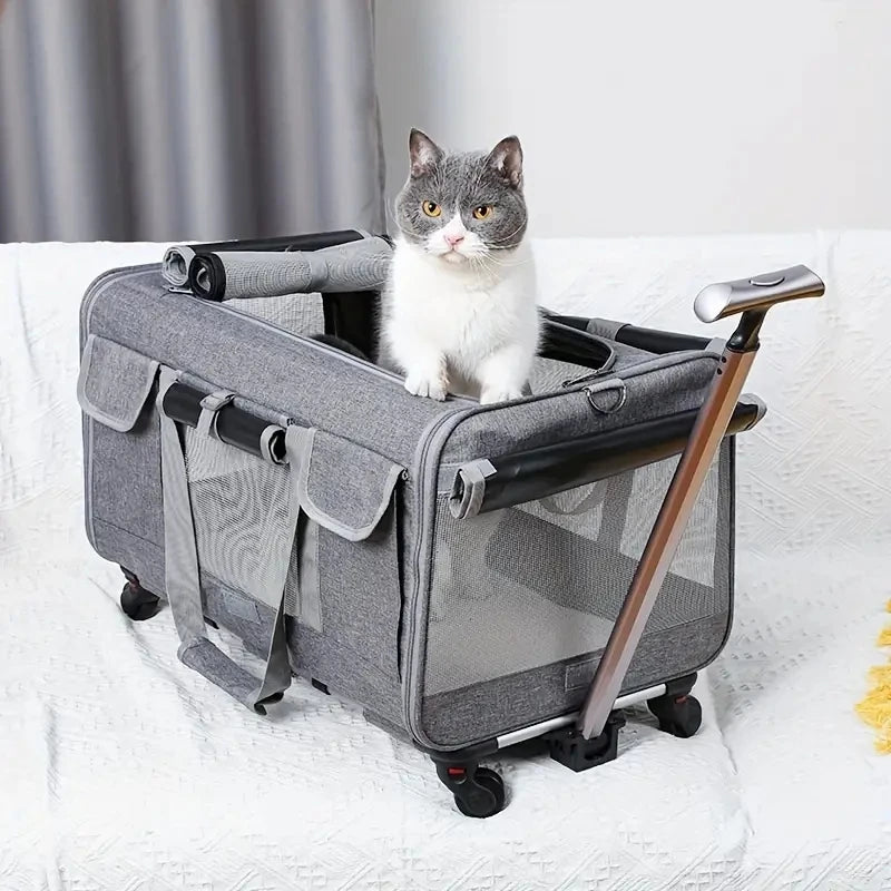 Un transporteur portable gris pour animaux avec une cage grillagée et un chat à l'intérieur sur une surface blanche.