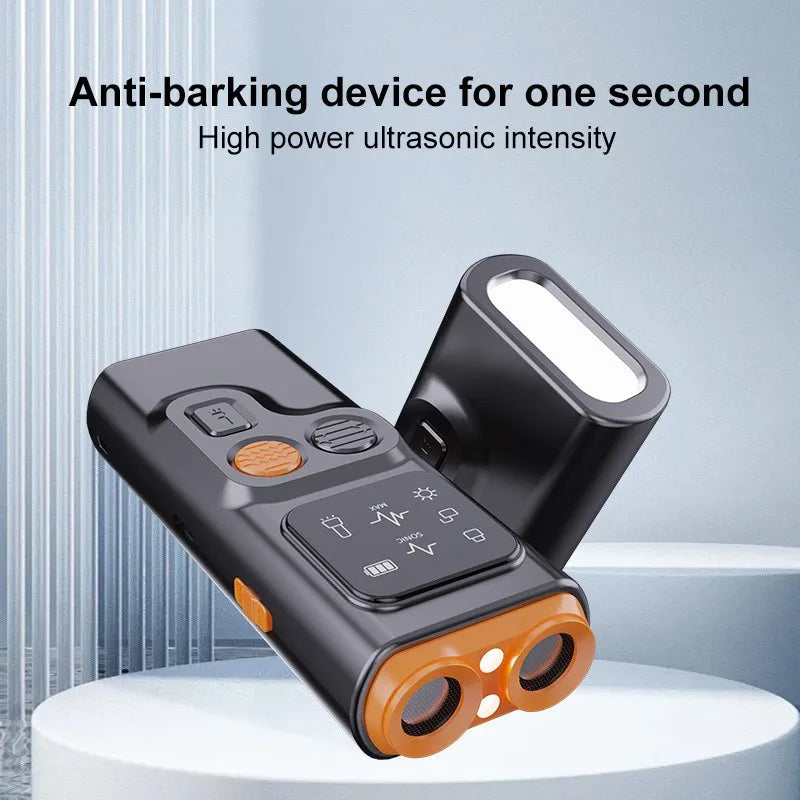 A black ultrasonic device with orange accents is shown on a white surface.