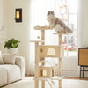 A multi-level cat tree with scratching posts and condos stands in a bright living room next to a sofa.