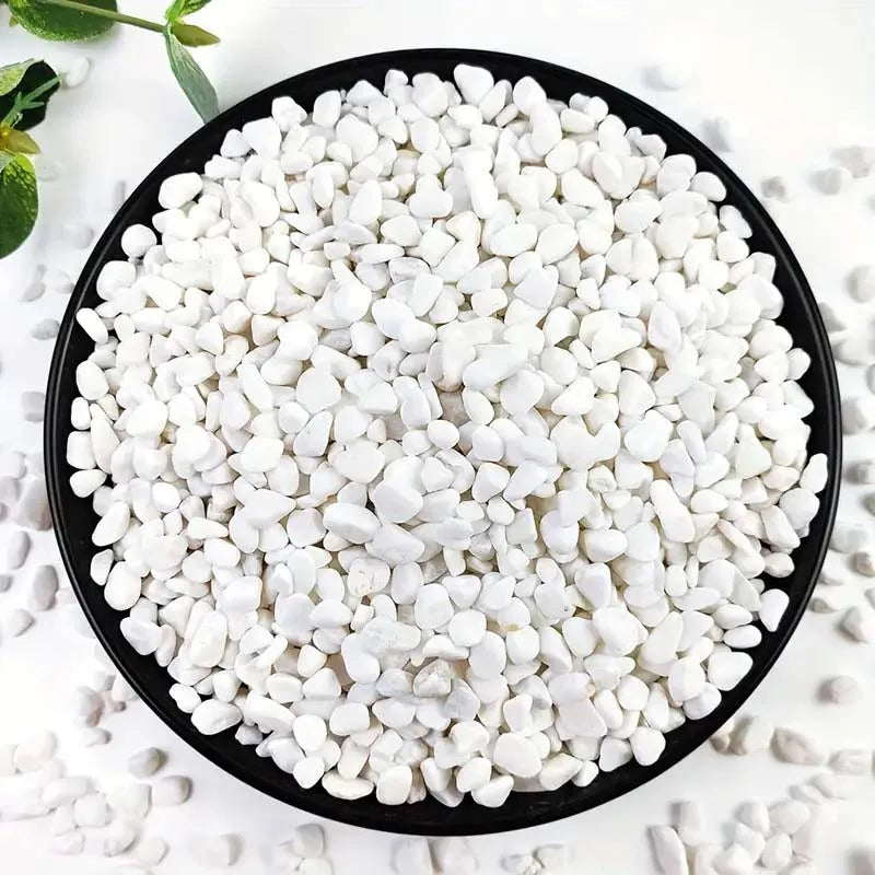 A black plate filled with natural white pebbles for plants and landscaping.
