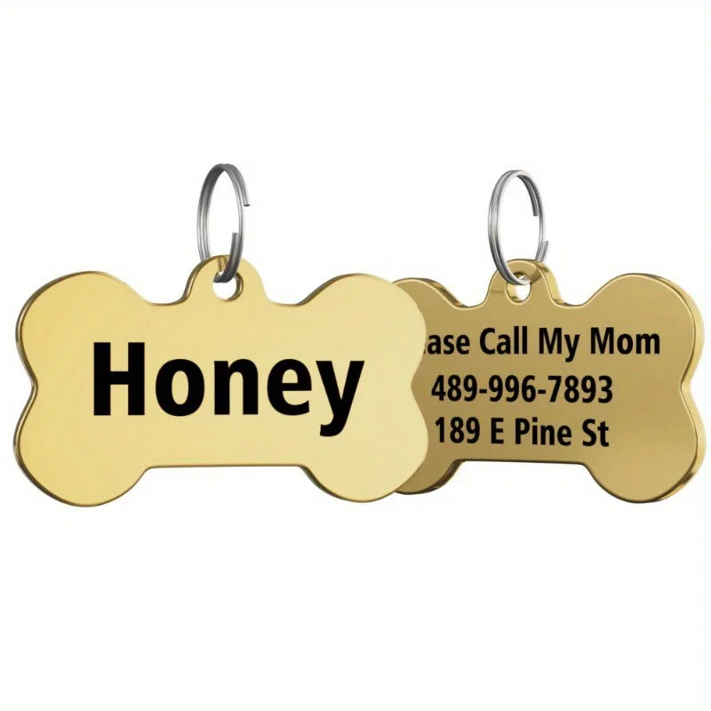 Gold bone-shaped stainless steel pet ID tag with contact information engraved on it