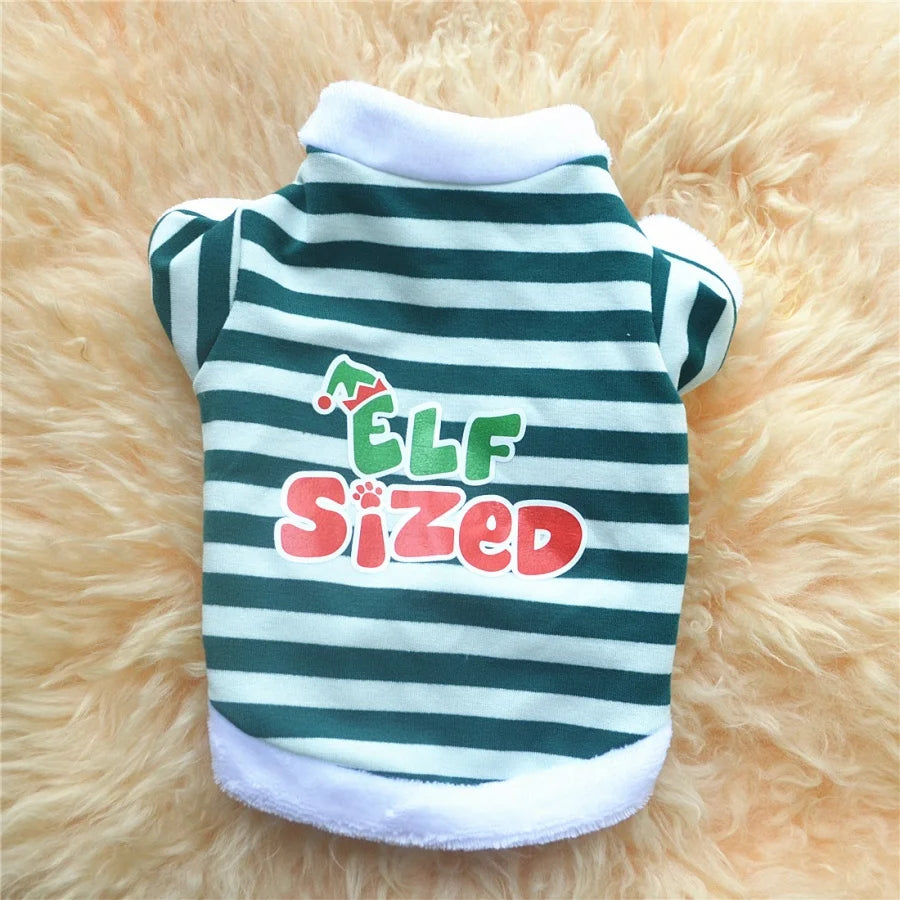 A green and black striped pet sweatshirt with red lettering that reads Elf Sized, displayed on a fluffy yellow background.