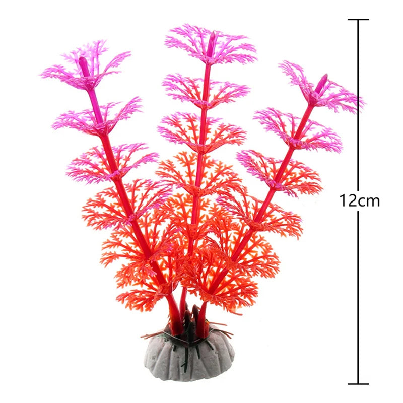 A vibrant red artificial aquarium plant with delicate, feathery pink and red fronds mounted on a base.