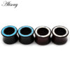 Five handmade wood ear tunnels with blue stone inlay, showing different finishes.