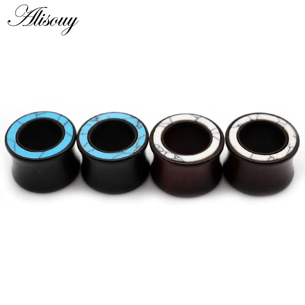 Five handmade wood ear tunnels with blue stone inlay, showing different finishes.