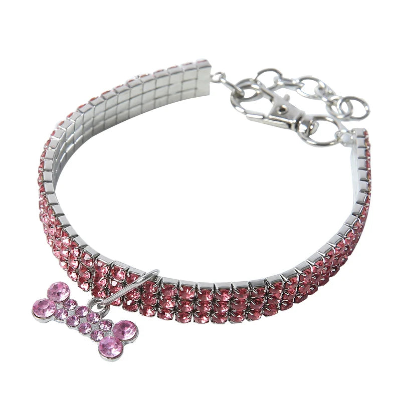 Silver collar with a rhinestone pendant shaped like a cat and a chain link clasp