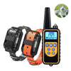 A black remote control dog training collar with an orange strap and a digital display is shown.