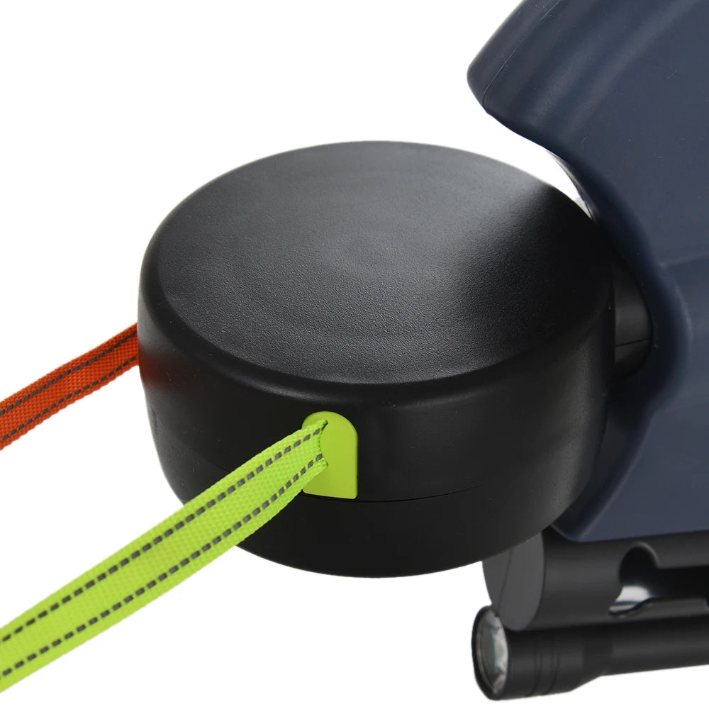 A close-up of a black dog leash with a bright yellow reflective nylon strap attached.