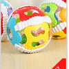 Colorful animal cartoon baby socks for toddlers displayed on a wooden surface.