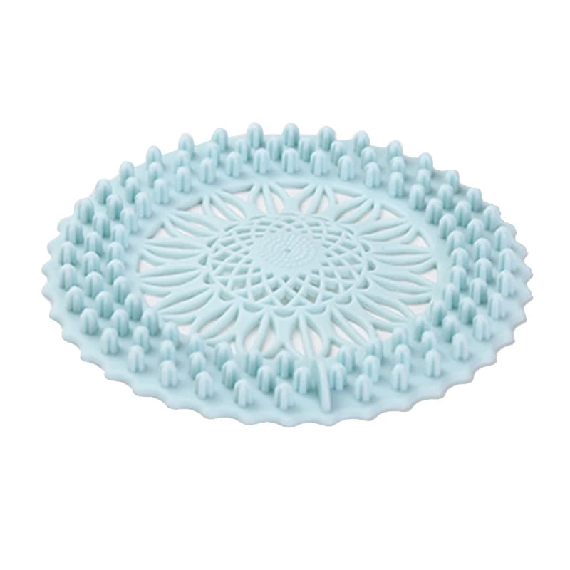 Light blue flexible silicone drain cover with a textured pattern for hair and debris