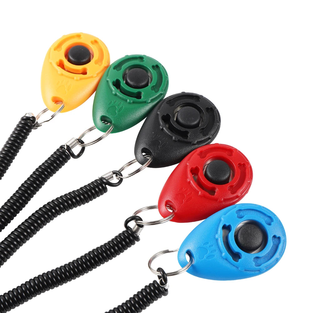 A set of five brightly colored pet training clickers with black wrist straps.