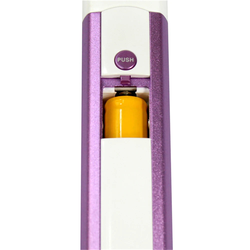 A close-up view of a white and purple electric pet grooming clipper with a yellow component and a push button.