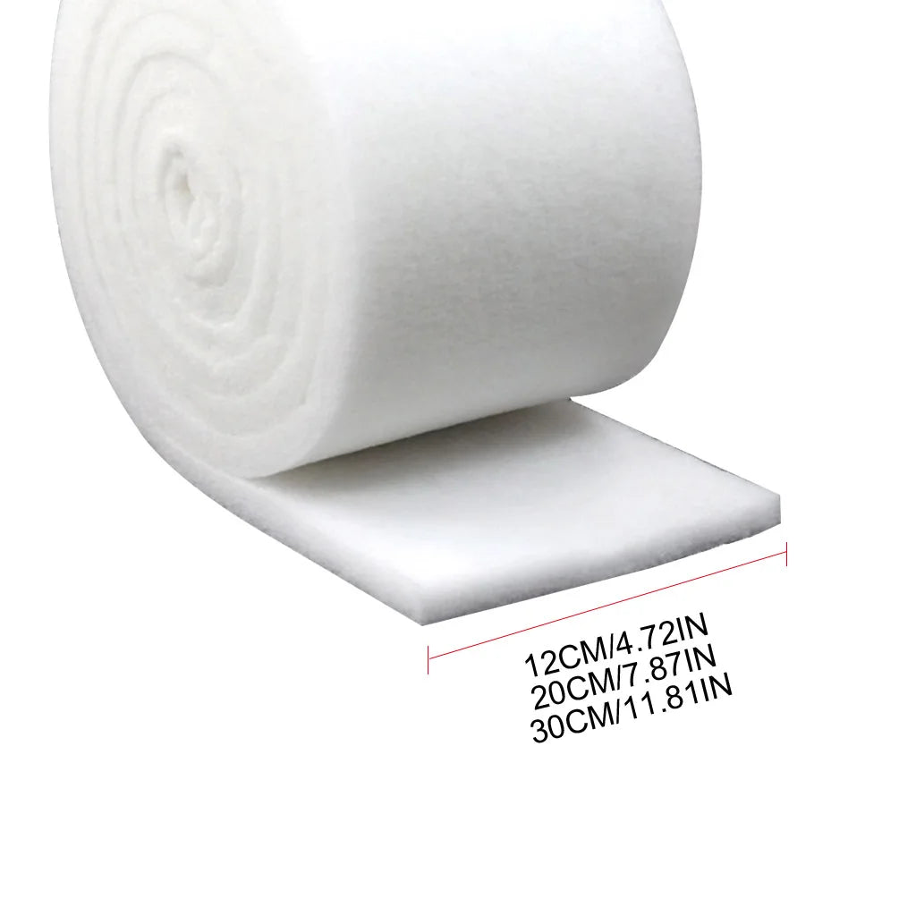 Roll of white dual-density aquarium filter sponge with size markings in centimeters and inches.
