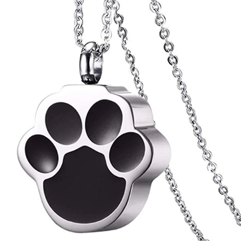 A silver stainless steel pet paw print necklace with a chain.