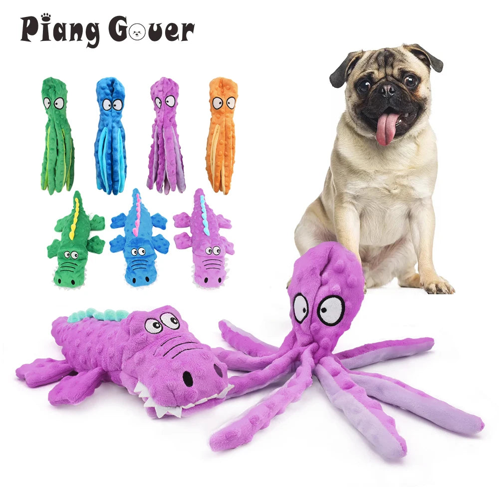 A collection of plush toys resembling various sea creatures and a dog, including a green, blue, purple, and orange elongated 