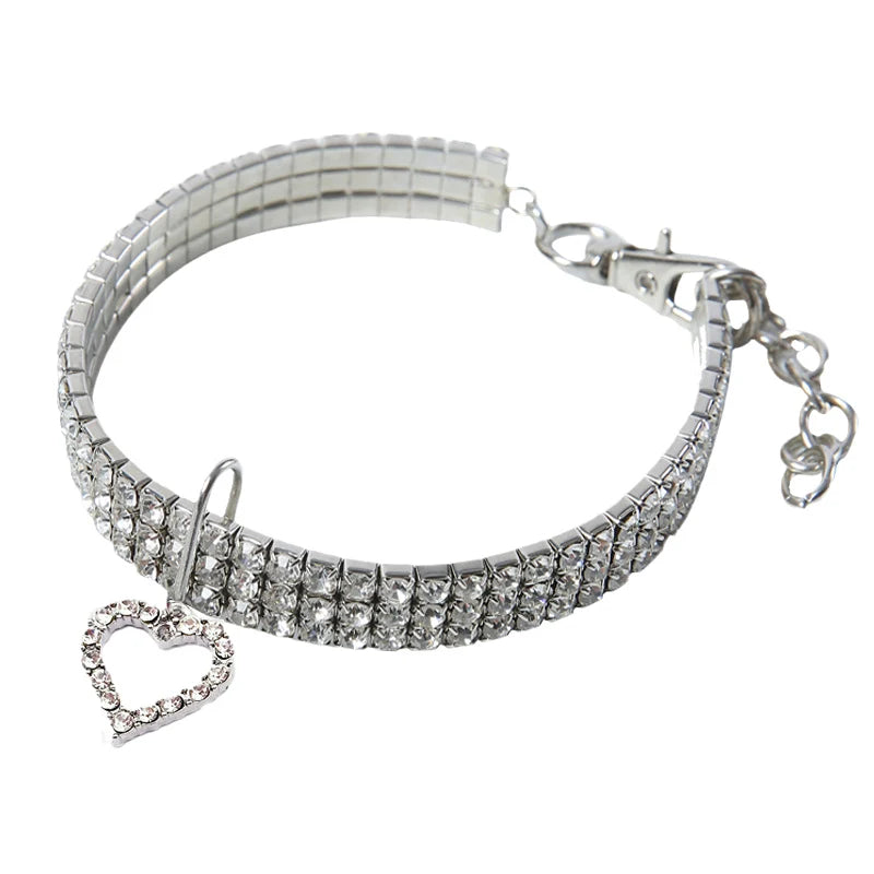 Silver rhinestone collar with a sparkling charm and a heart pendant
