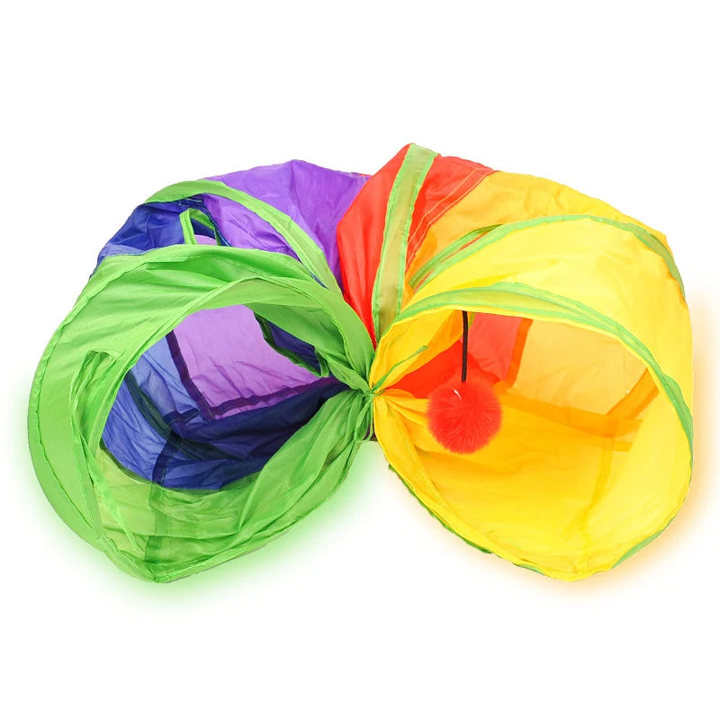 A colorful collapsible pet play tunnel with green, purple, and orange fabric.