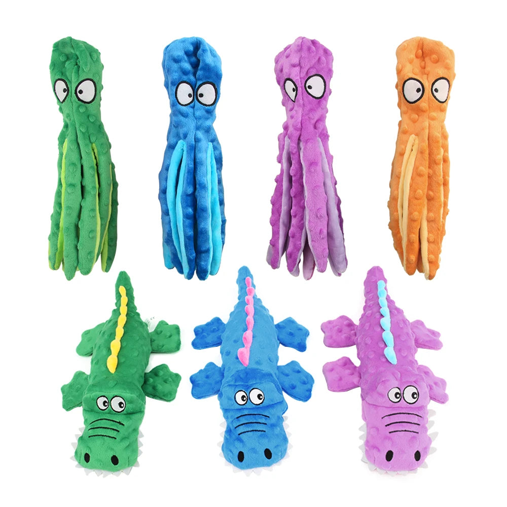 A set of five colorful, textured squeak dog toys shaped like elongated, stylized animals.