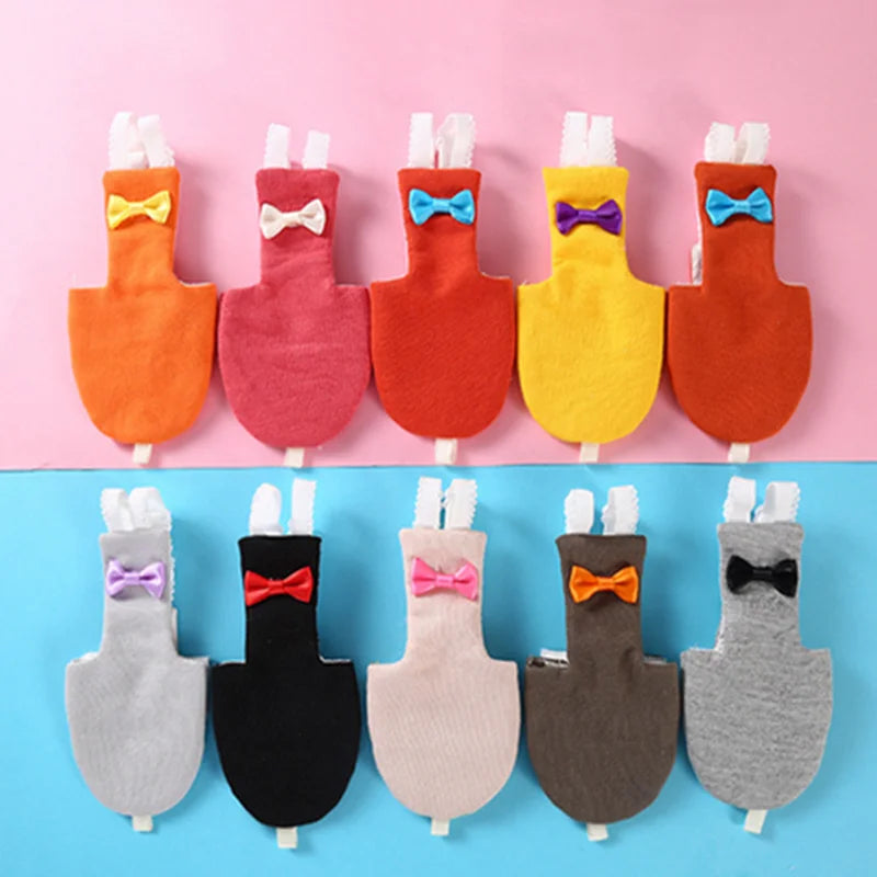 A set of bird parrot diapers featuring various colors and bow tie flight suit designs.