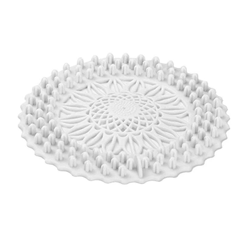 White flexible silicone drain cover with a handle used for hair and debris