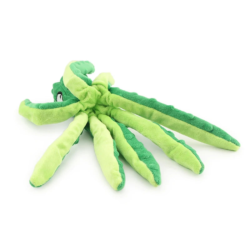 A green interactive squeak dog toy shaped like a starfish with multiple tentacles.