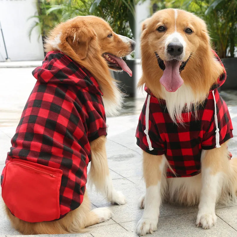 A golden retriever wearing a red and black plaid jacket with a cozy fleece lining.