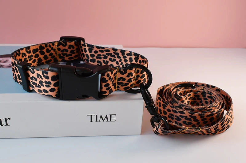 A brown leopard print dog collar and leash set resting on a white box.