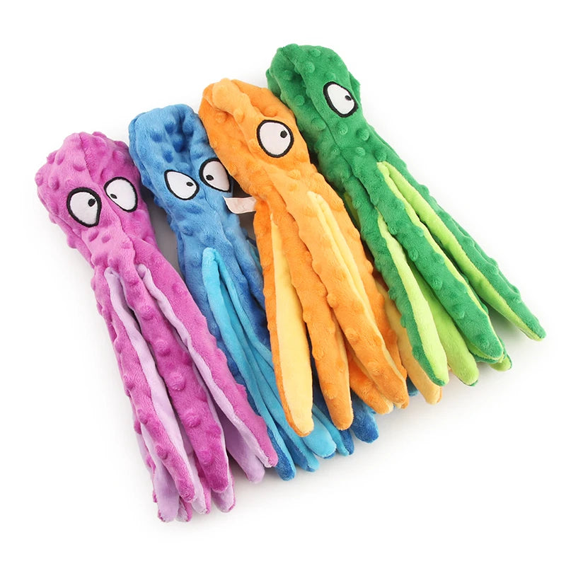 A collection of colorful, plush squeak dog toys shaped like elongated dogs for puppies.