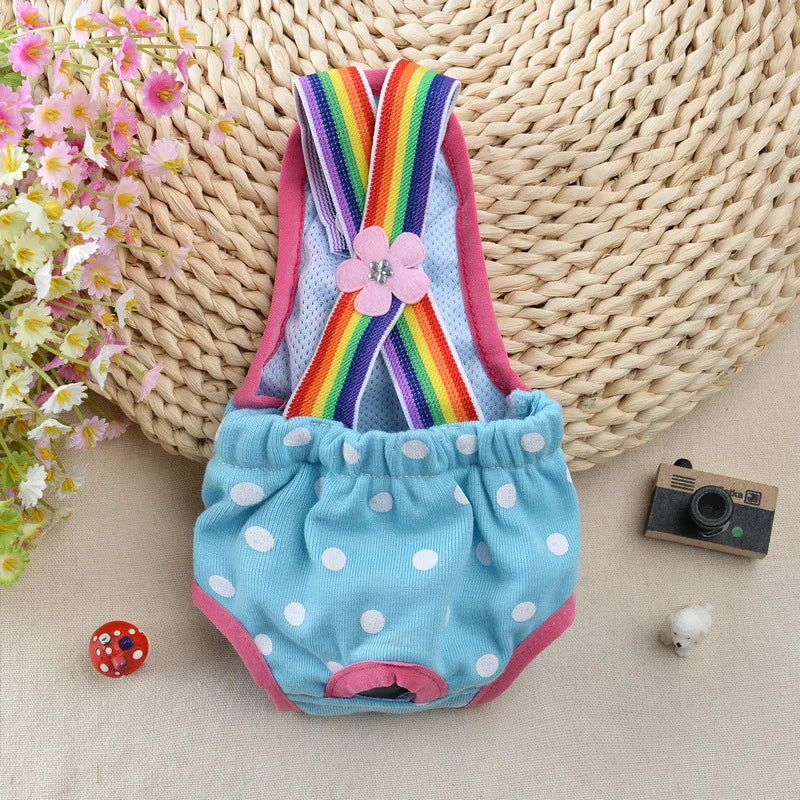 A colorful striped physiological dog underwear item displayed on a beige woven mat.