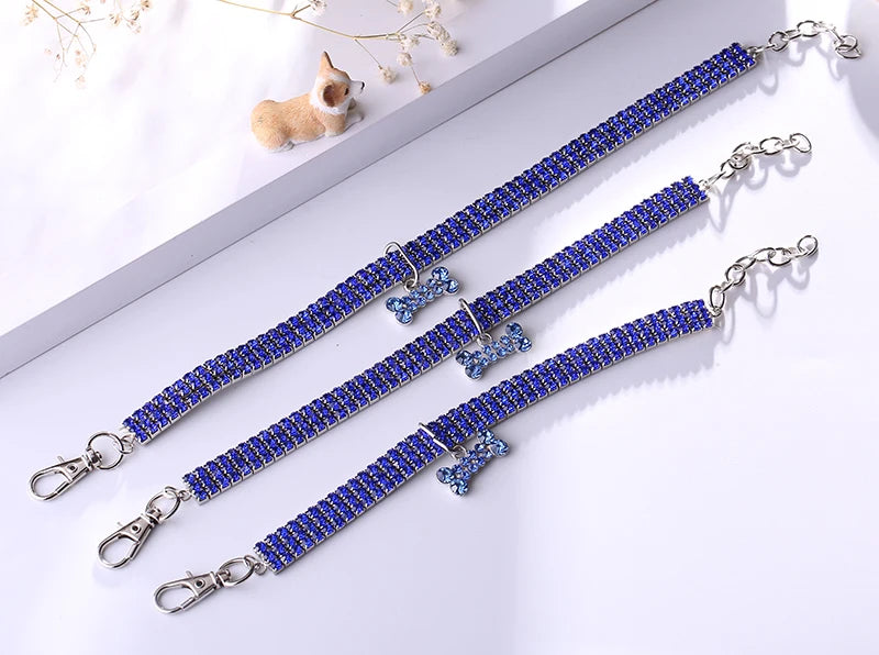 Elegant rhinestone pendant cat collar featuring sparkling blue stones and charm details.