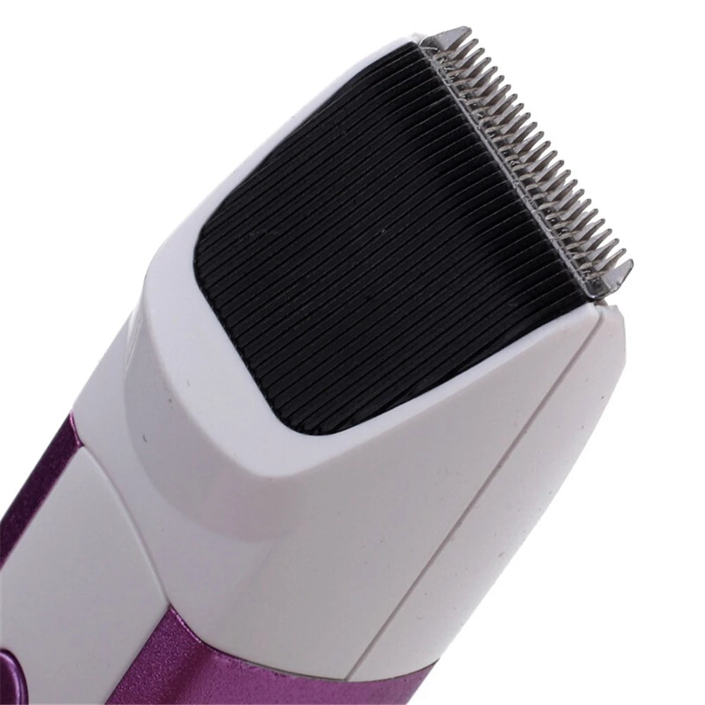 Close-up view of a white and purple electric pet grooming clipper with a black cutting head.