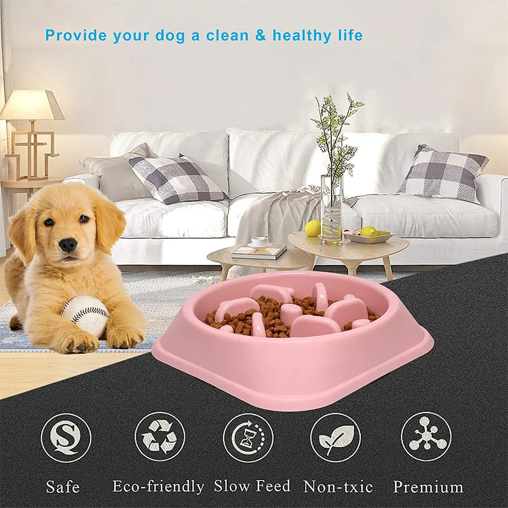 Pink non-slip slow feeder bowl for dogs with various puzzle pieces and treats