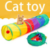 A bright yellow and green collapsible pet play tunnel with a hanging toy is shown.