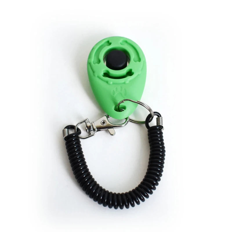 A bright green pet training clicker with a black button and a metal wrist strap.