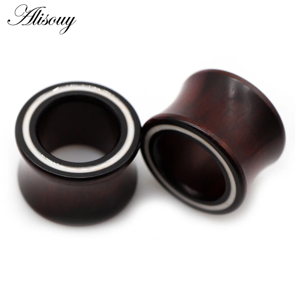 A dark brown wooden ear tunnel with a white inlay, shown against a white background.