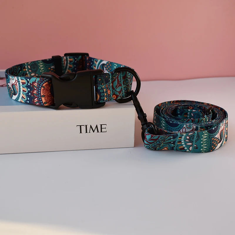A patterned fabric dog collar and leash set rests on a white box with the word TIME visible.