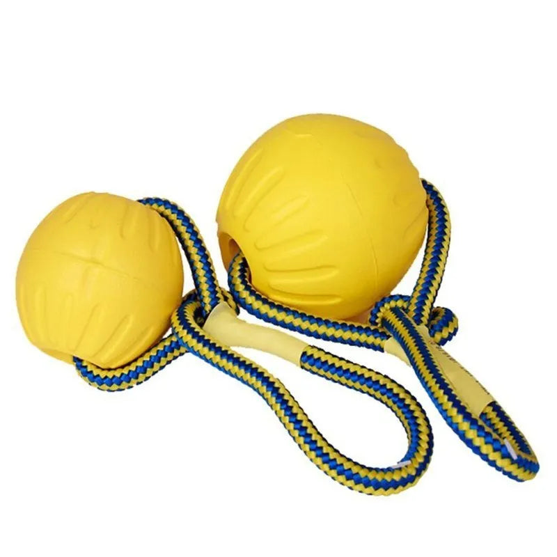 Yellow rubber dog chew ball with a blue rope for fetch and training