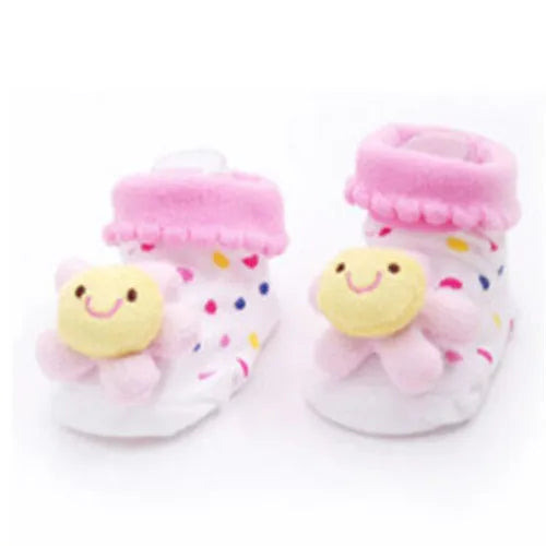 Pair of pink fuzzy animal cartoon baby socks with yellow embroidered faces