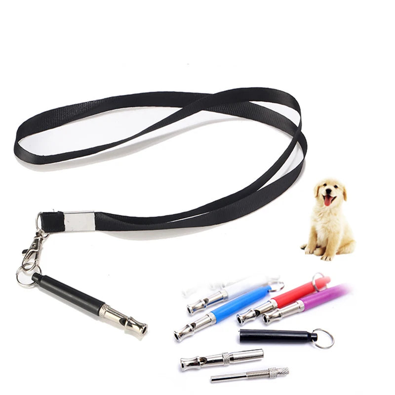 Black adjustable dog training whistle with a lanyard and several replacement whistles