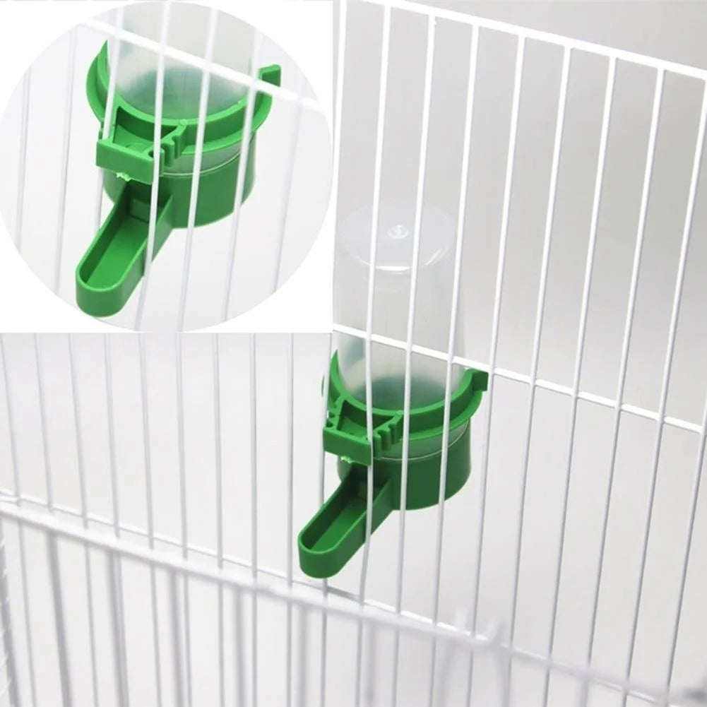 A green clip-on bird feeder and waterer set is shown attached to a wire cage.