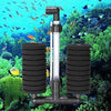 A clear aquarium biochemical sponge filter with black components is shown submerged in a vibrant underwater environment.