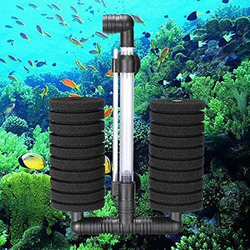 A clear aquarium biochemical sponge filter with black components is shown submerged in a vibrant underwater environment.