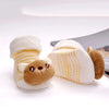 A cute animal cartoon baby sock resembling a bear, featuring tan and white stripes.