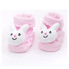 Pair of pink fuzzy baby socks with white animal cartoon faces for toddlers