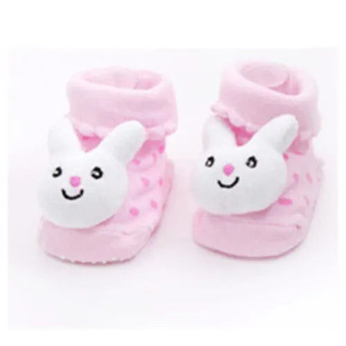 Pair of pink fuzzy baby socks with white animal cartoon faces for toddlers