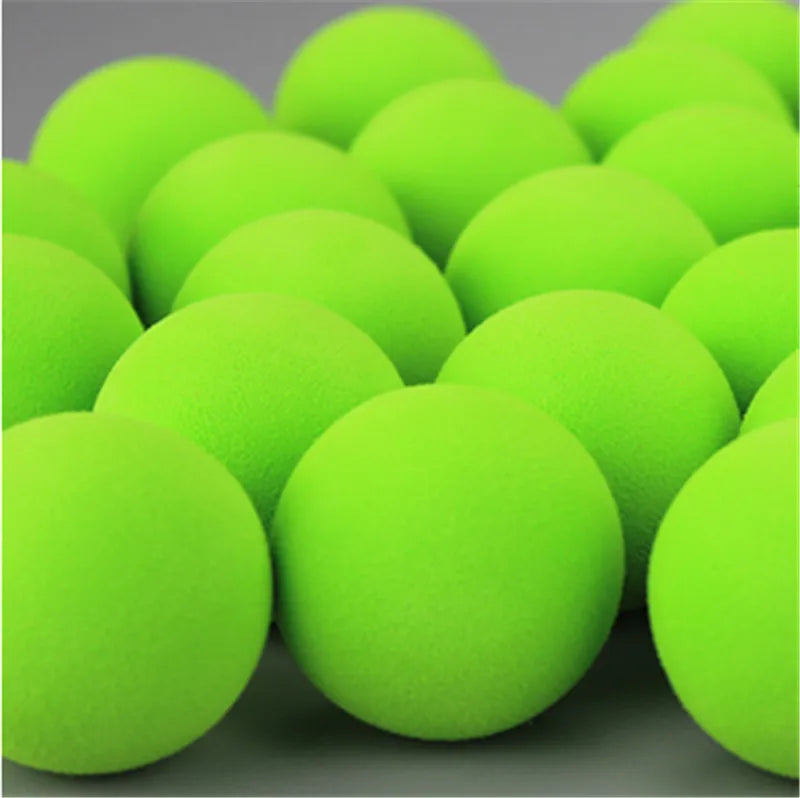 A pack of bright lime green EVA foam practice golf balls shown in a close-up view.