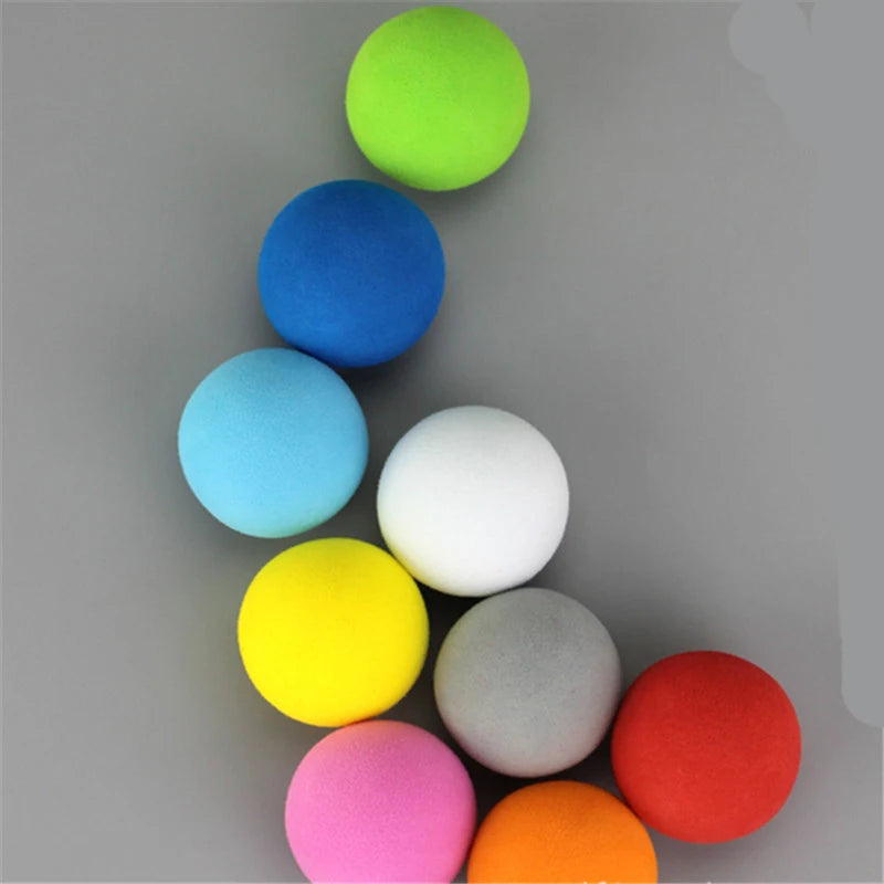 A collection of ten brightly colored EVA foam practice golf balls arranged in a vertical line.