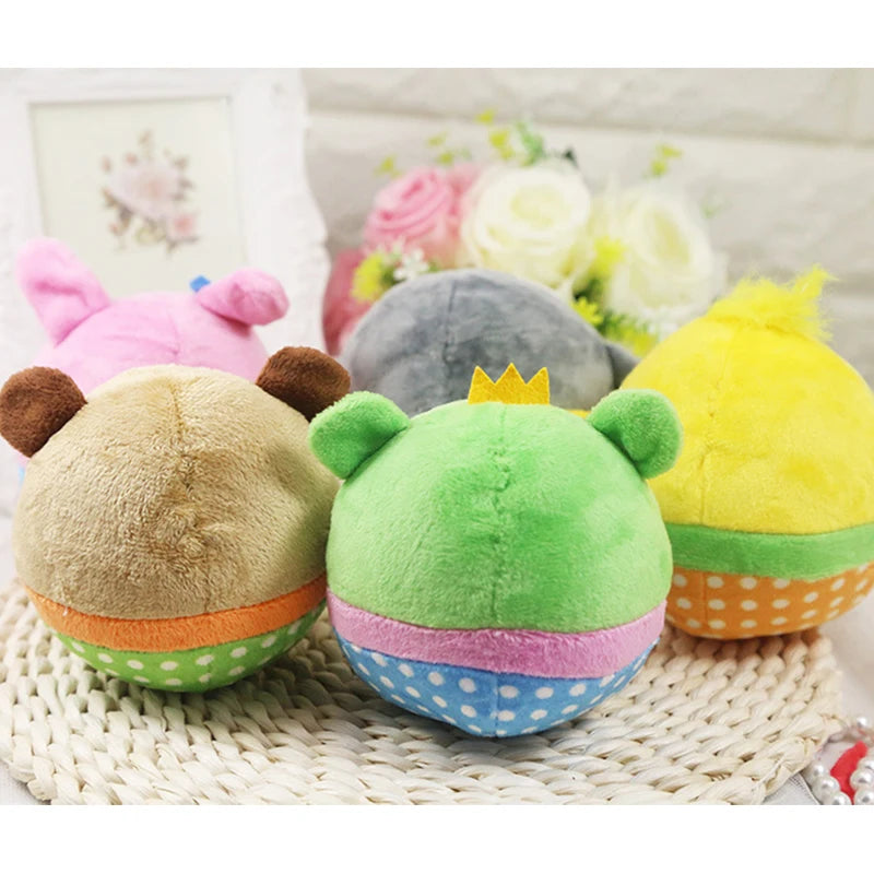 A collection of colorful plush squeaker dog toys featuring pink, gray, and yellow dogs.