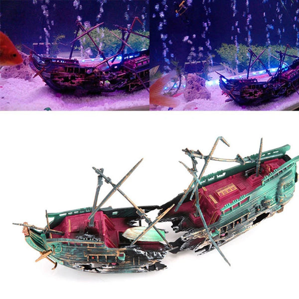 A detailed model of a sailing ship with masts and rigging, featuring green and red accents.