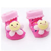 Pair of pink fuzzy animal cartoon baby socks with ruffled cuffs